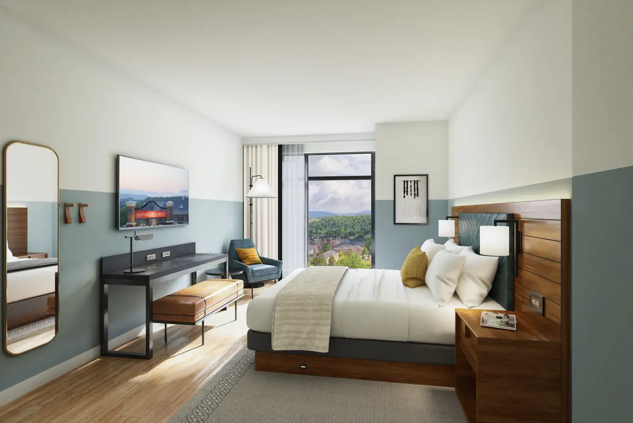 A king guest room with a view toward campus.